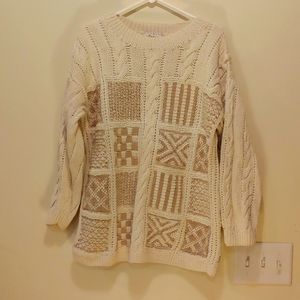 Womans multiple pattern cable sweater